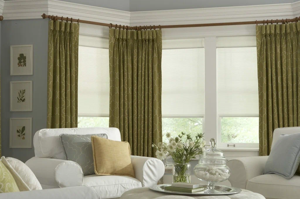 Green pinch pleat curtains in villa living room